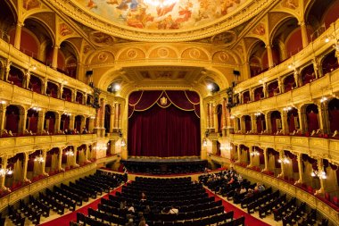 BUDAPEST, HUNGARY- NOVEMBER 27 2016: Interior of the Hungarian Royal State Opera House, considered one of the architect's masterpieces and has the third best acoustics in Europe.  clipart