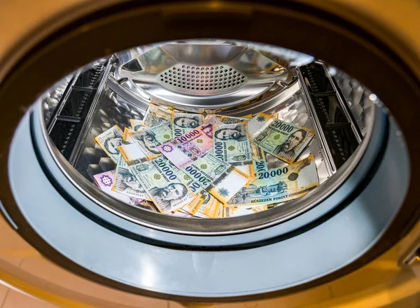 Banknotes in wash machine, close up view