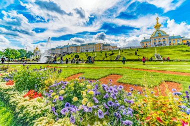 ST. PETERSBURG, RUSSIA - AUGUST 12, 2018: The grounds of the Peterhof Palace, UNESCO world heritage site, with fountains and gardens clipart