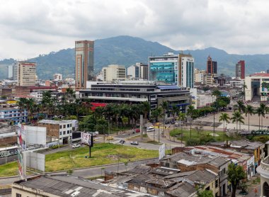 PEREIRA, COLOMBIA - OCTOBER 25, 2015: Areal view of Pereira at rainy day. The city is located in the foothills of the Andes in a coffee-producing area of Colombia officially known as the Coffee Axis. clipart