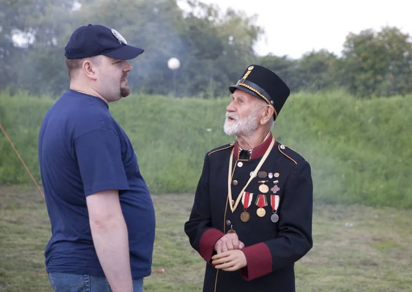 Meeting with old men in military uniform