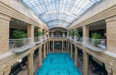 BUDAPEST, HUNGARY - NOVEMBER 4, 2017: Swimming pool interior in Gellert Spa and Bath, a popular thermal bath in art Nouveau style, opened since 1918. clipart