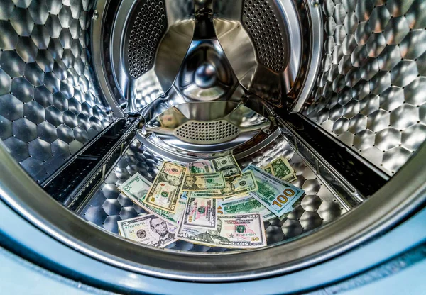 Banknotes in wash machine, close up view