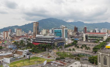 PEREIRA, COLOMBIA - OCTOBER 25, 2015: Areal view of Pereira at rainy day. The city is located in the foothills of the Andes in a coffee-producing area of Colombia officially known as the Coffee Axis. clipart
