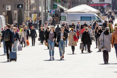 HELSINKI, FINLAND - 4 MAY 2016: people in the center of Helsinki. Helsinki is Finland's major political, educational, financial, cultural, and research center clipart