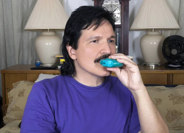 Latino Man Uses His Quick Relief Bronchodilator Asthma His Bedroom — Stock Photo, Image