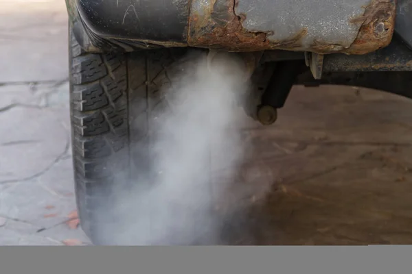 the toxic exhaust of a car badly spoils the environment