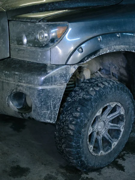 big dirty wheel on the drive from the four-wheel drive pickup track