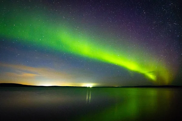 Beautiful  Northern Lights (polar lights, aurora borealis) in September (unique phenomenon) on the starry sky