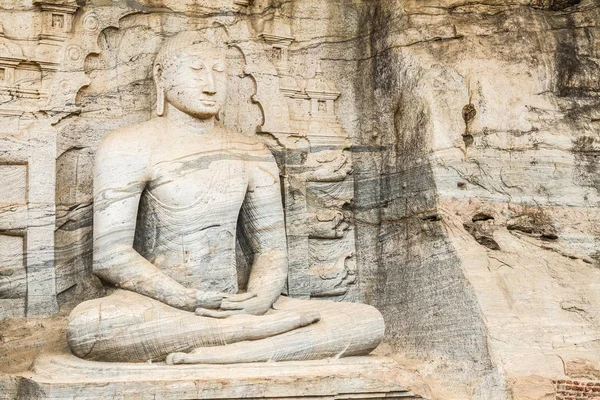 Sri Lanka, Polonnaruwa, The Palace Complex of King Parakramabahu. Gal Viharaya. Ancient Sinhalese rock temple with 4 Buddha statues, including 2 seated, 1 standing & 1 reclining