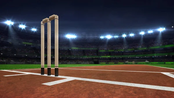 Osvětlený kulatý kriketový stadion v noci se dřevěné branky — Stock fotografie