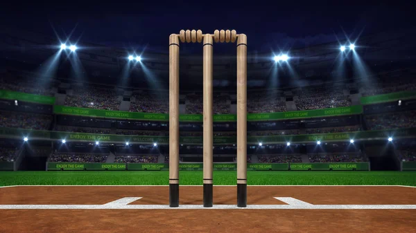 Vista nocturna del estadio de cricket con luz de foco y wickets de madera de primer plano —  Fotos de Stock