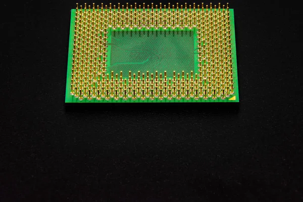 The processor for a personal computer has many pins for connecting to devices on the motherboard. Gold plated contacts