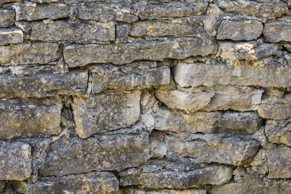Die alte Mauer aus grauen Steinen — Stockfoto