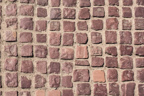 Road for pedestrians from granite stones