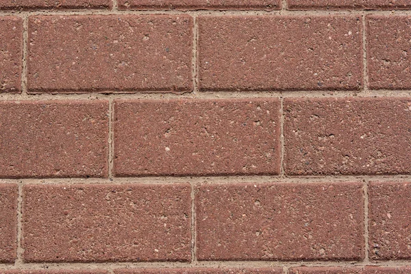 Mauer aus roten Granitsteinen — Stockfoto