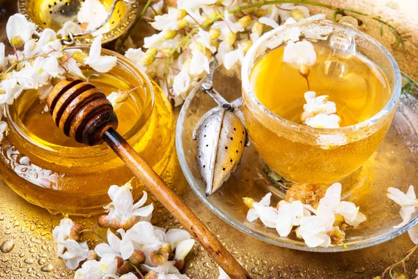Healing herbal tea with honey from acacia flowers.Herbal tea