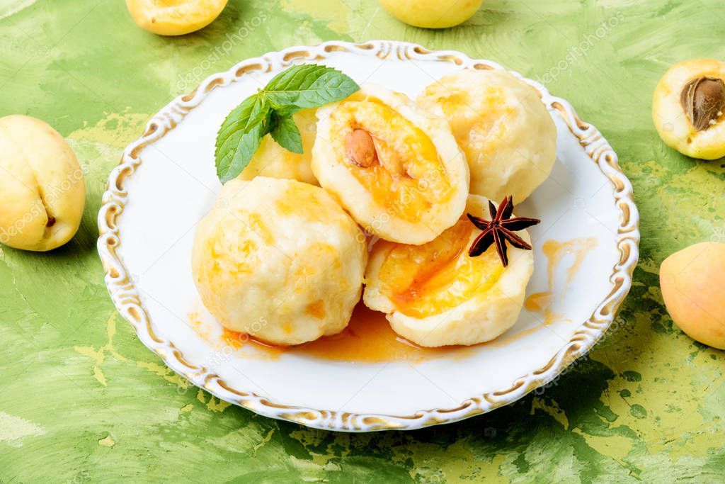 Fruit dumplings with apricot and spicy syrup