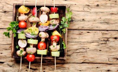 Grilled vegetable kebabs on skewers with tomato, pepper, mushrooms,zucchini and onion.Vegan diet.Vegetables kebab clipart