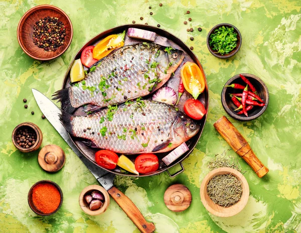Fish with herbs, spices and vegetables - healthy food.Dietary food