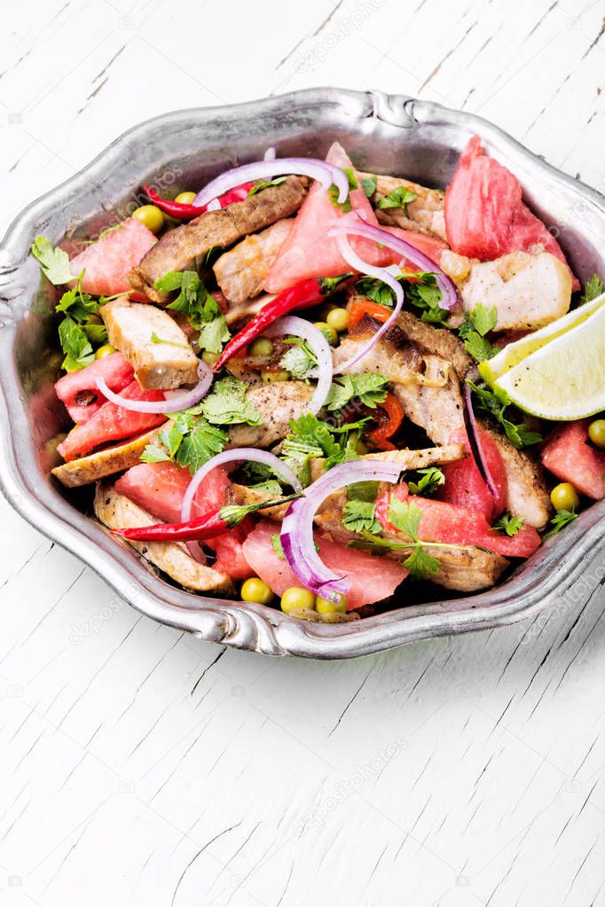 Summer salad with beef meat, watermelon and lime.Exotic food