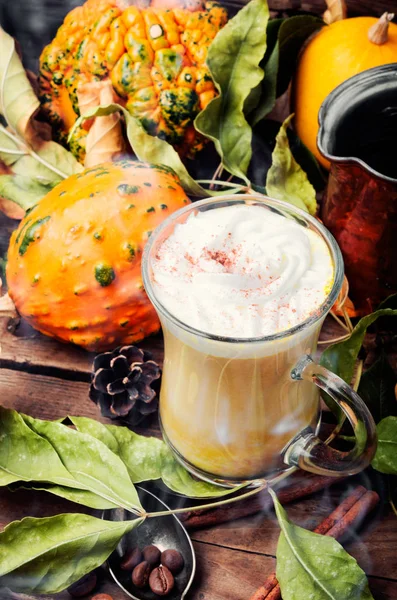 Pumpkin spice coffee with whipped cream.Autumn coffee.Coffee drink.