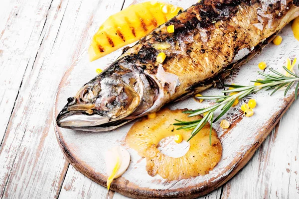Delicious roasted fish with pineapple.Fishes baked in baking dish