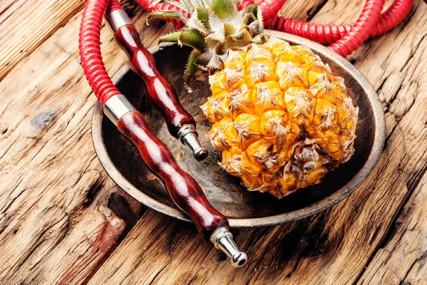 Fashionable fruit smoking hookah with a tobacco flavor of pineapple.Eastern shisha.Smoking hookah.