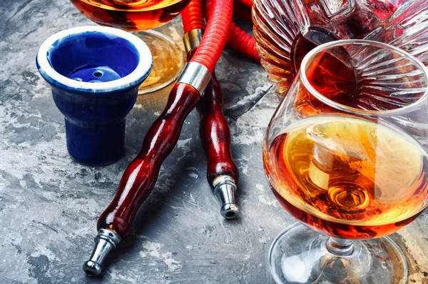 Smoking hookah with cognac flavor — Stock Photo, Image