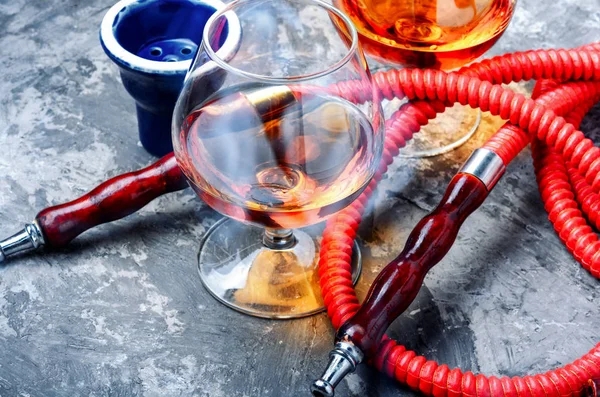 Smoking hookah with cognac flavor — Stock Photo, Image