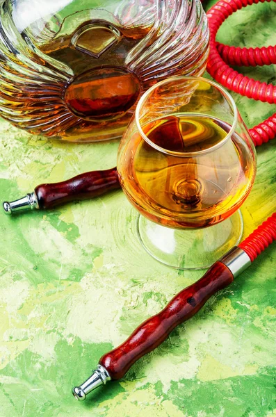 Smoking hookah with cognac flavor — Stock Photo, Image