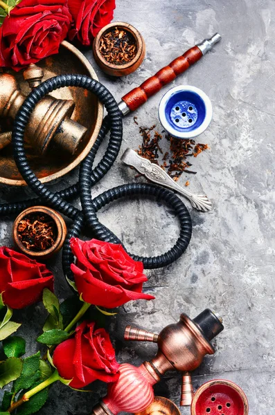 Smoking hookah with rose flavor — Stock Photo, Image