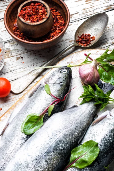 Fresh fish on wooden background — Stock Photo, Image