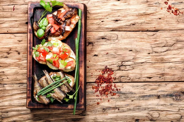 Bruschetta with various toppings. — Stock Photo, Image