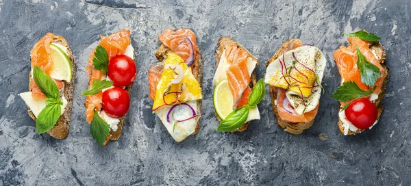 Assorted bruschetta with fish — Stock Photo, Image