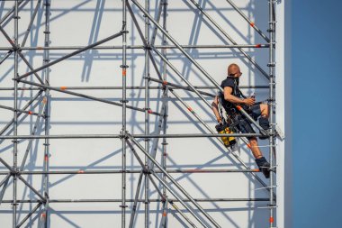 Construction of the scaffolding for The Passion clipart
