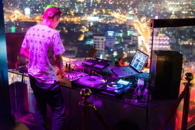 DJ - Party on top of building with music entertainment clipart