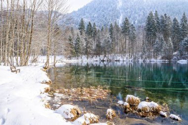 Lake Christlessee in winter at Trettach valley near oberstdorf, idyllic south bavarian landscape in Germany clipart