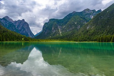 Lake Dobbiaco (Toblacher See, Lago di Dobbiaco) in Dolomite Alps, South Tirol, Italy - Travel destination in Europe clipart