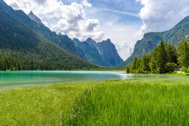 Lake Dobbiaco (Toblacher See, Lago di Dobbiaco) in Dolomite Alps, South Tirol, Italy - Travel destination in Europe clipart