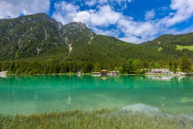 Lake Dobbiaco (Toblacher See, Lago di Dobbiaco) in Dolomite Alps, South Tirol, Italy - Travel destination in Europe clipart