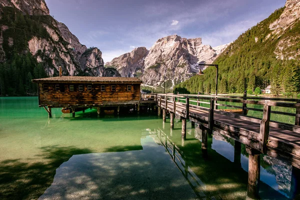 Wooden lake house at Lake Braies also known as Pragser Wildsee  in beautiful mountain scenery. Amazing Travel destination Lago di Braies in Dolomites, South Tyrol, Italy, Europe.
