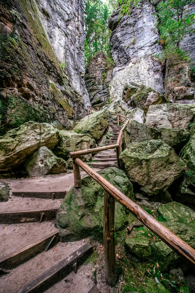 stock image Hiking in Schwedenloecher Valley in Bastei National Park Saxon Switzerland, above the Elbe River in the Elbe Sandstone Mountains, Germany.