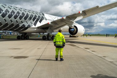 BERLIN, GERMANY - APRIL 26, 2018: Fragment of wide-body jet airliner Airbus A350 XWB on the taxiway. Exhibition ILA Berlin Air Show 2018 clipart