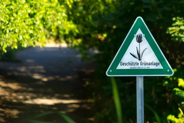 Advarsel Trekantet Tegn Med Grøn Kant Blomsterbillede Midten Oversættelse Fra - Stock-foto