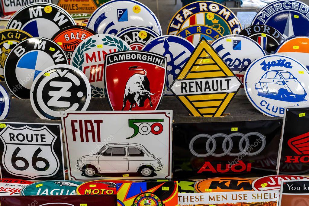 PAAREN IM GLIEN, GERMANY - MAY 19, 2018: The background of the emblems of various auto and moto brands. Die Oldtimer Show 2018.