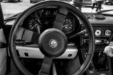 PAAREN IM GLIEN, GERMANY - MAY 19, 2018: Interior of a sports car Alfa Romeo Spider Series 3. Black and white. Exhibition 