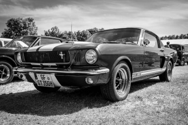 PAAREN IM GLIEN, GERMANY - MAY 19, 2018: Pony car Shelby Cobra GT350, (high-performance version of the Ford Mustang). Black and white. Die Oldtimer Show 2018. clipart