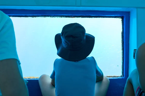 Boy Watching Underwater World Large Porthole Waterline Tourist Ship — Stock Photo, Image