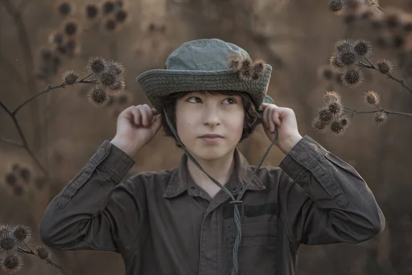 Boy Hat Coveralls Standing Dry Bushes Burdock — Stock Photo, Image